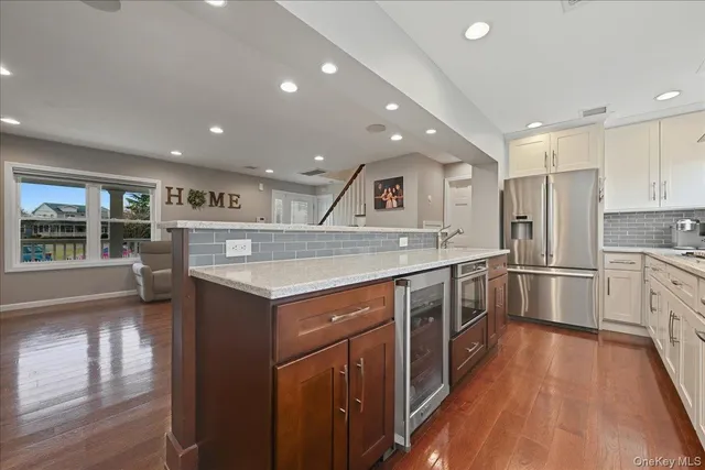 a kitchen with a stove sink and a refrigerator