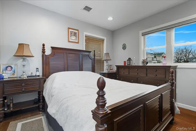 a bed room with a bed and a television