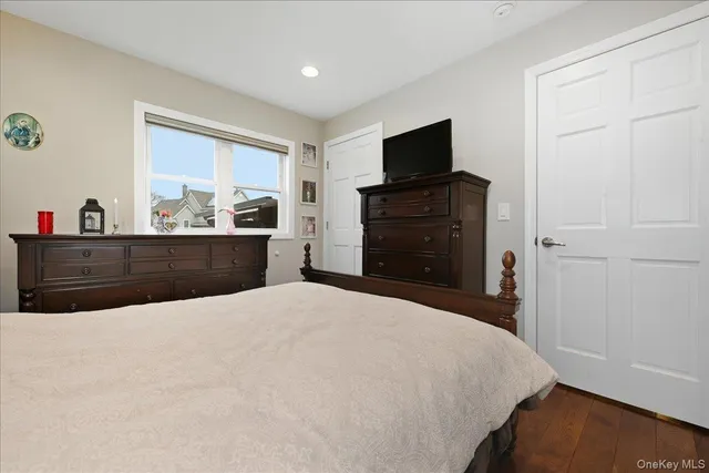 a bed room with a bed and a television