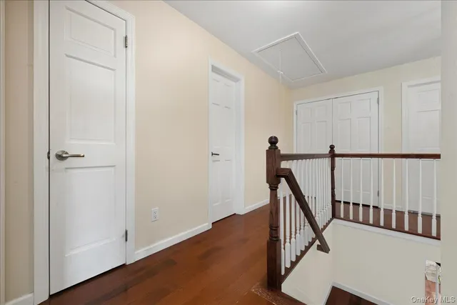 a view of an entryway with hardwood floor and hallway