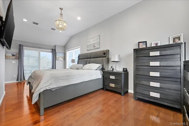 a bed room with a bed and a television