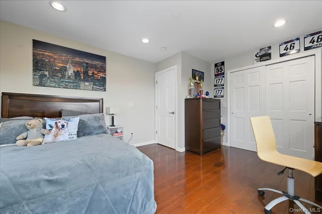 a bedroom with bed and a couch