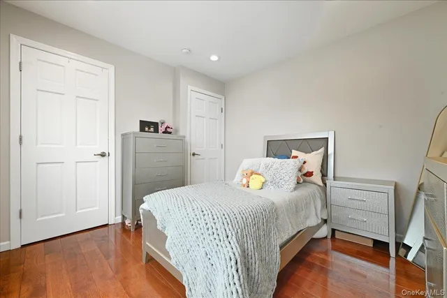 a bedroom with a bed and a closet