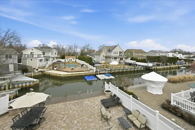 a view of a lake with couches and city view