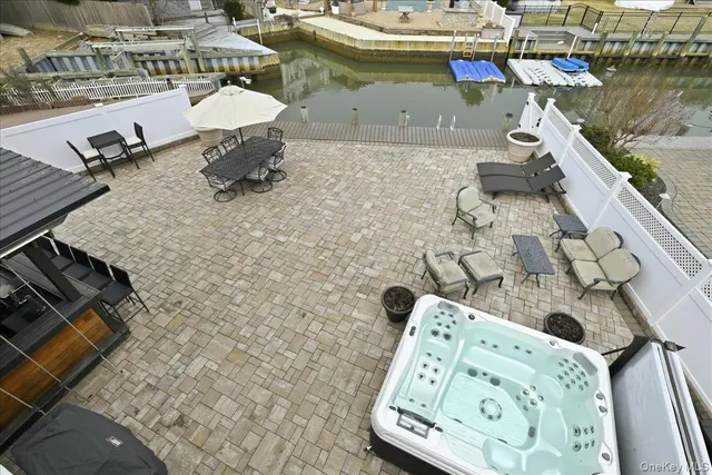 a view of roof deck with chairs