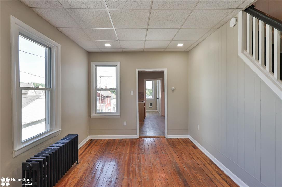 619 Sioux Street Bethlehem, PA 18015 - Photo 15 of 61 a view of an empty room with wooden floor and a window
