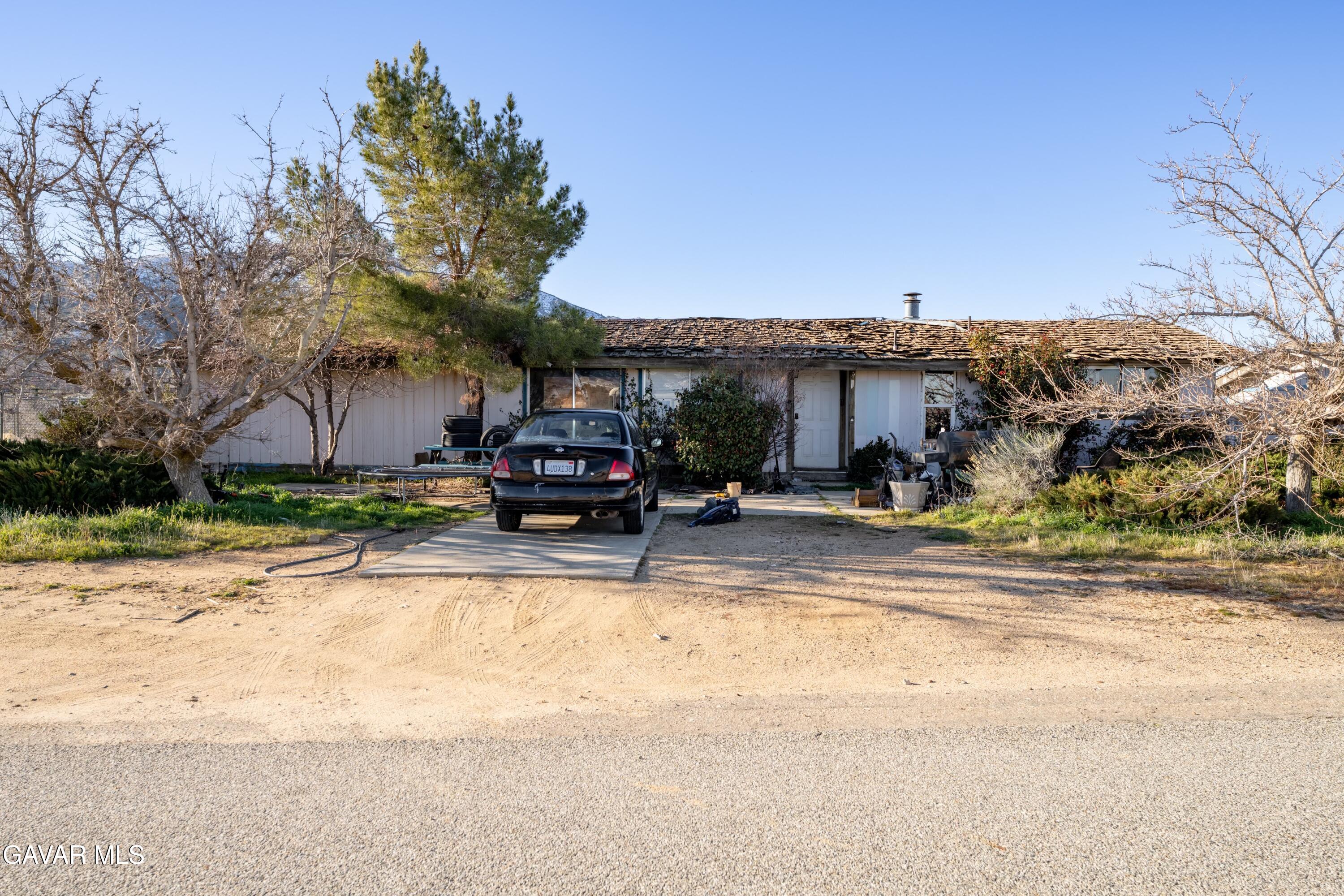 20625 Ridgecrest Drive Tehachapi, CA 93561 - Photo 2 of 2 a view of building with cars parked