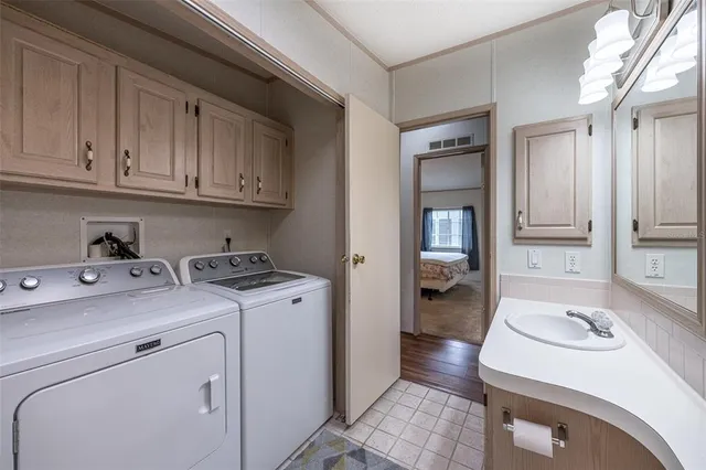 a utility room with closet dryer and washer