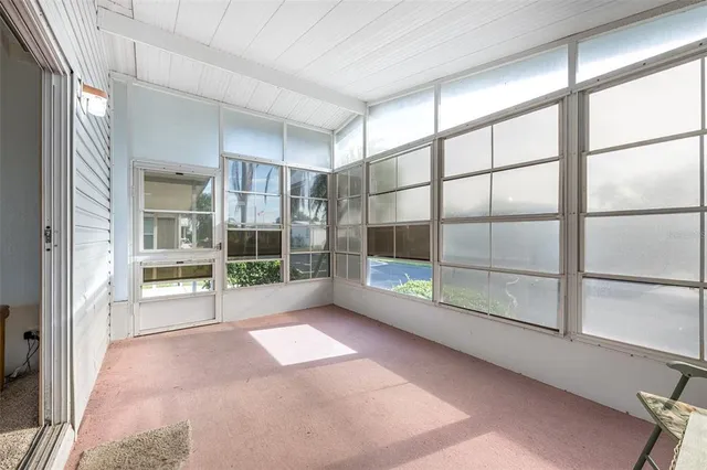 a view of an empty room with a sliding door