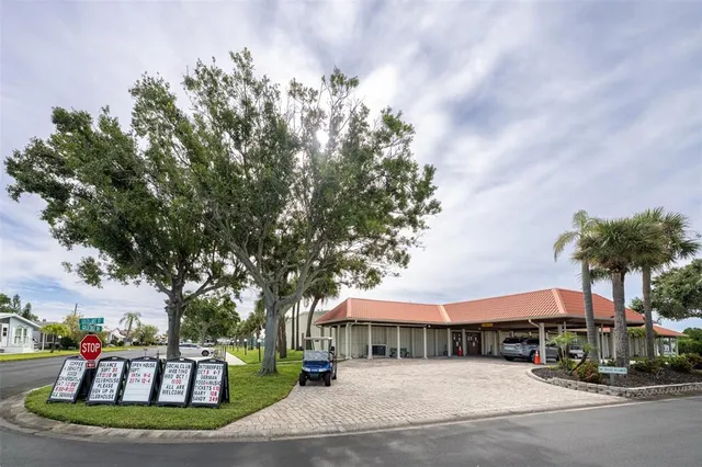 a sign board with a yard and plants
