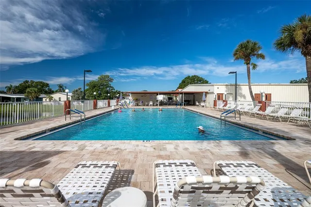 a view of a balcony with chair and table