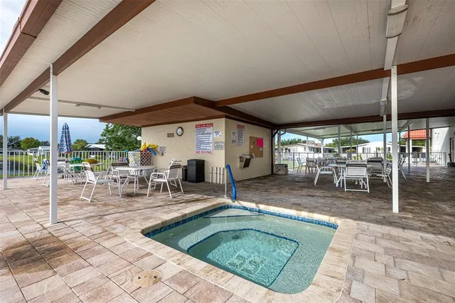 a view of a swimming pool with a patio