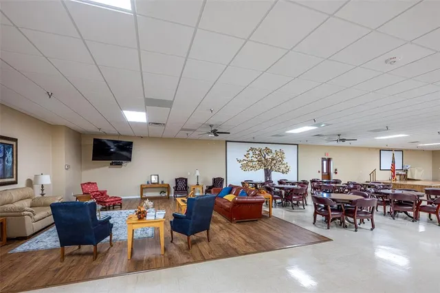 a living room with lots of furniture and a flat screen tv
