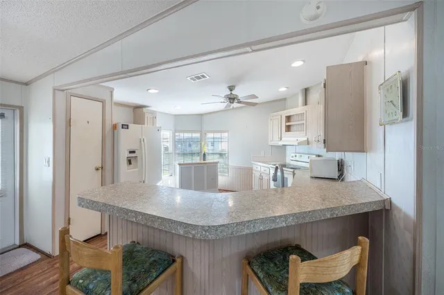 a dining table with kitchen island granite countertop furniture and a granite counter top
