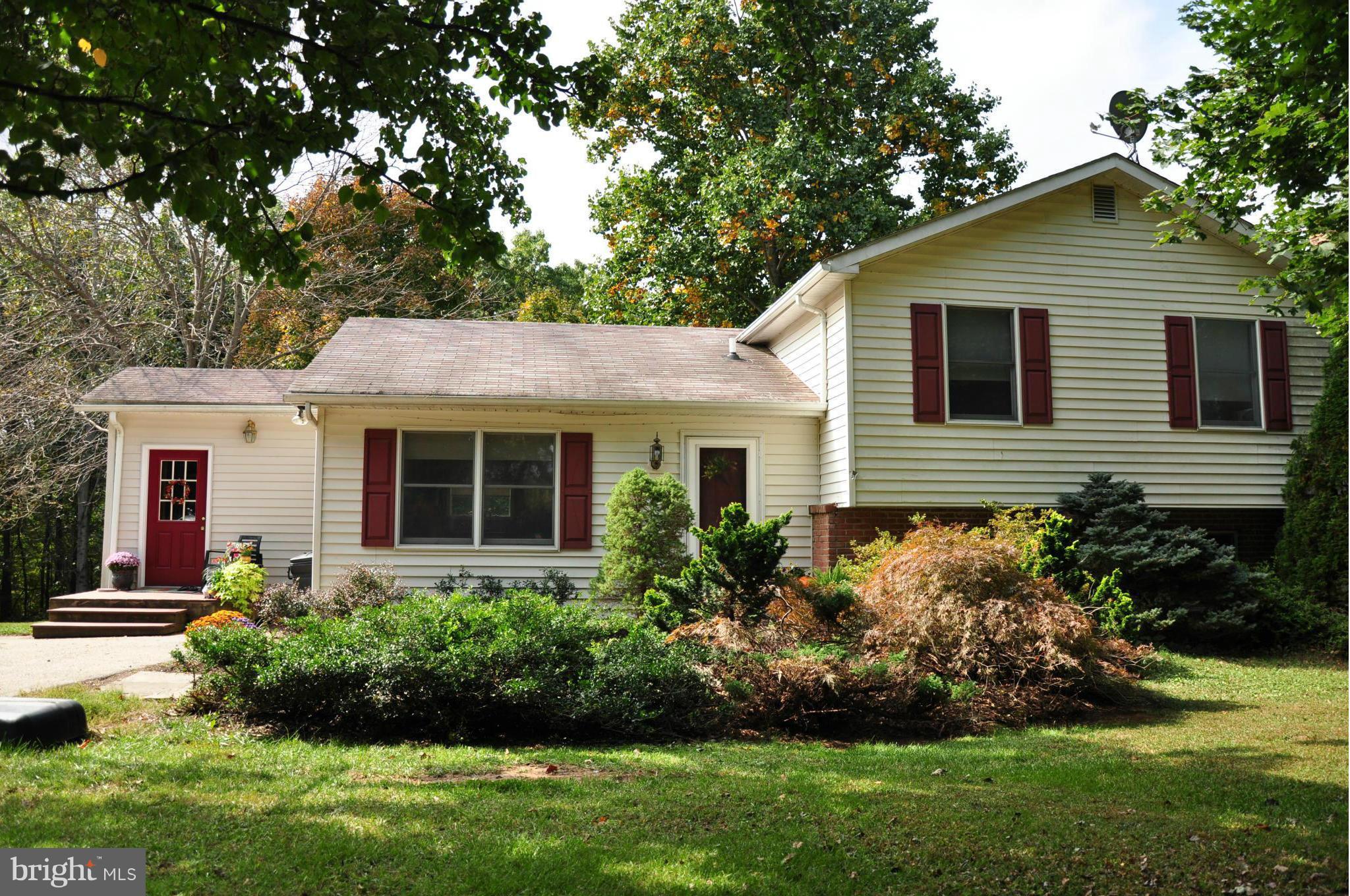 18608 Upper Beckleysville Road Hampstead, MD 21074 - Photo 1 of 29 a view of a house with a yard and plants