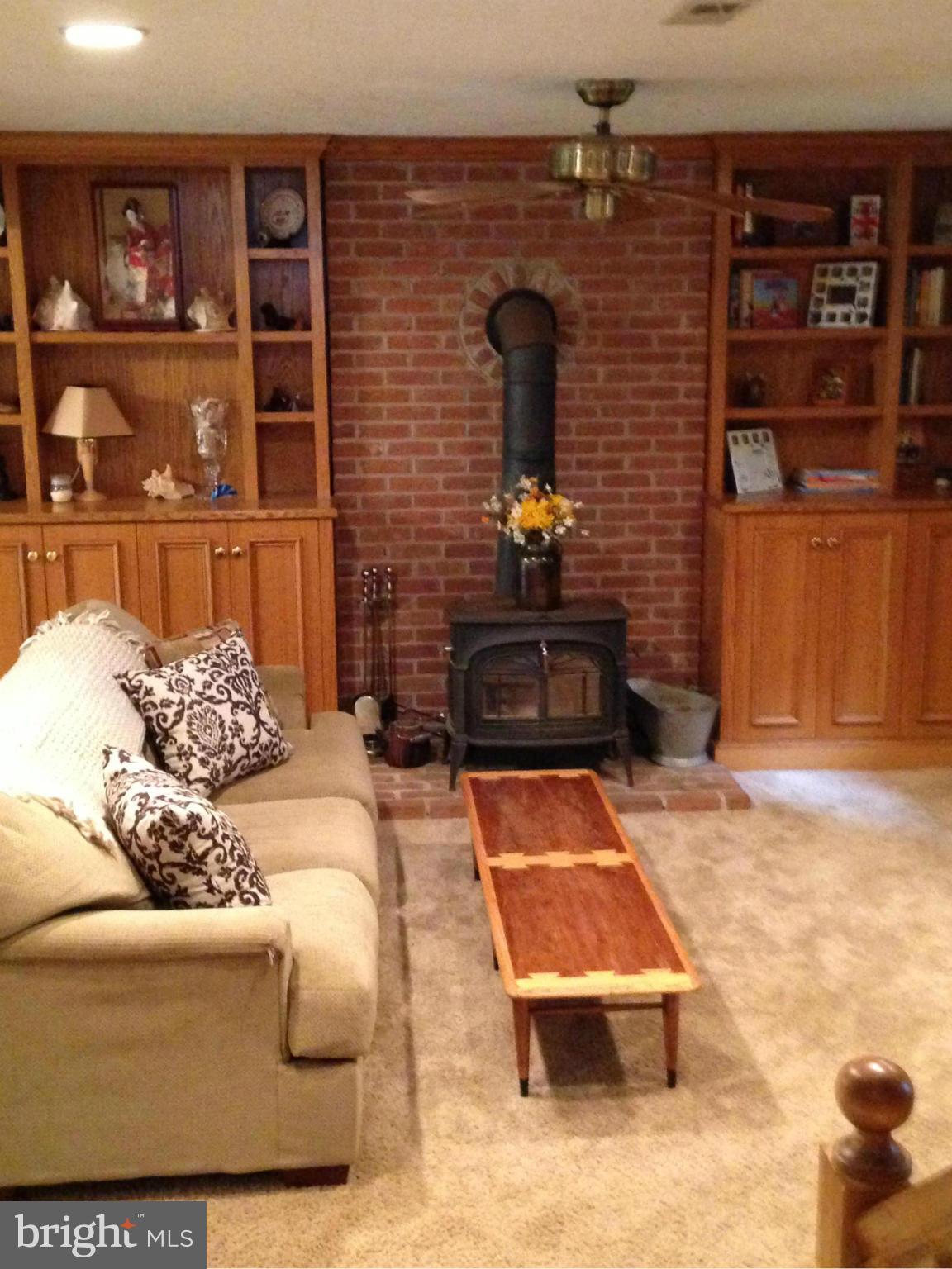 18608 Upper Beckleysville Road Hampstead, MD 21074 - Photo 16 of 29 a living room with couch and a bookshelf