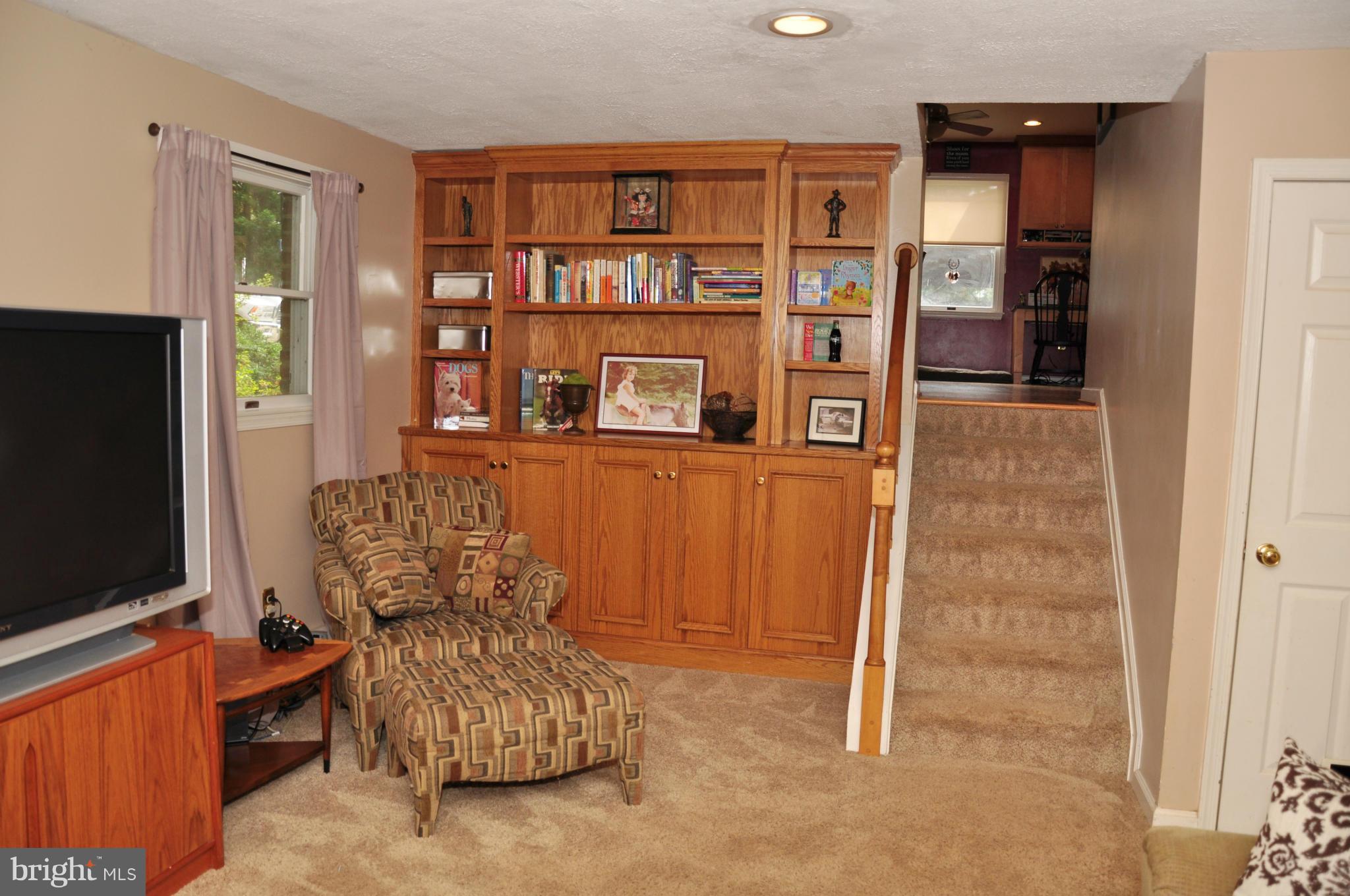 18608 Upper Beckleysville Road Hampstead, MD 21074 - Photo 18 of 29 a living room with furniture and a flat screen tv