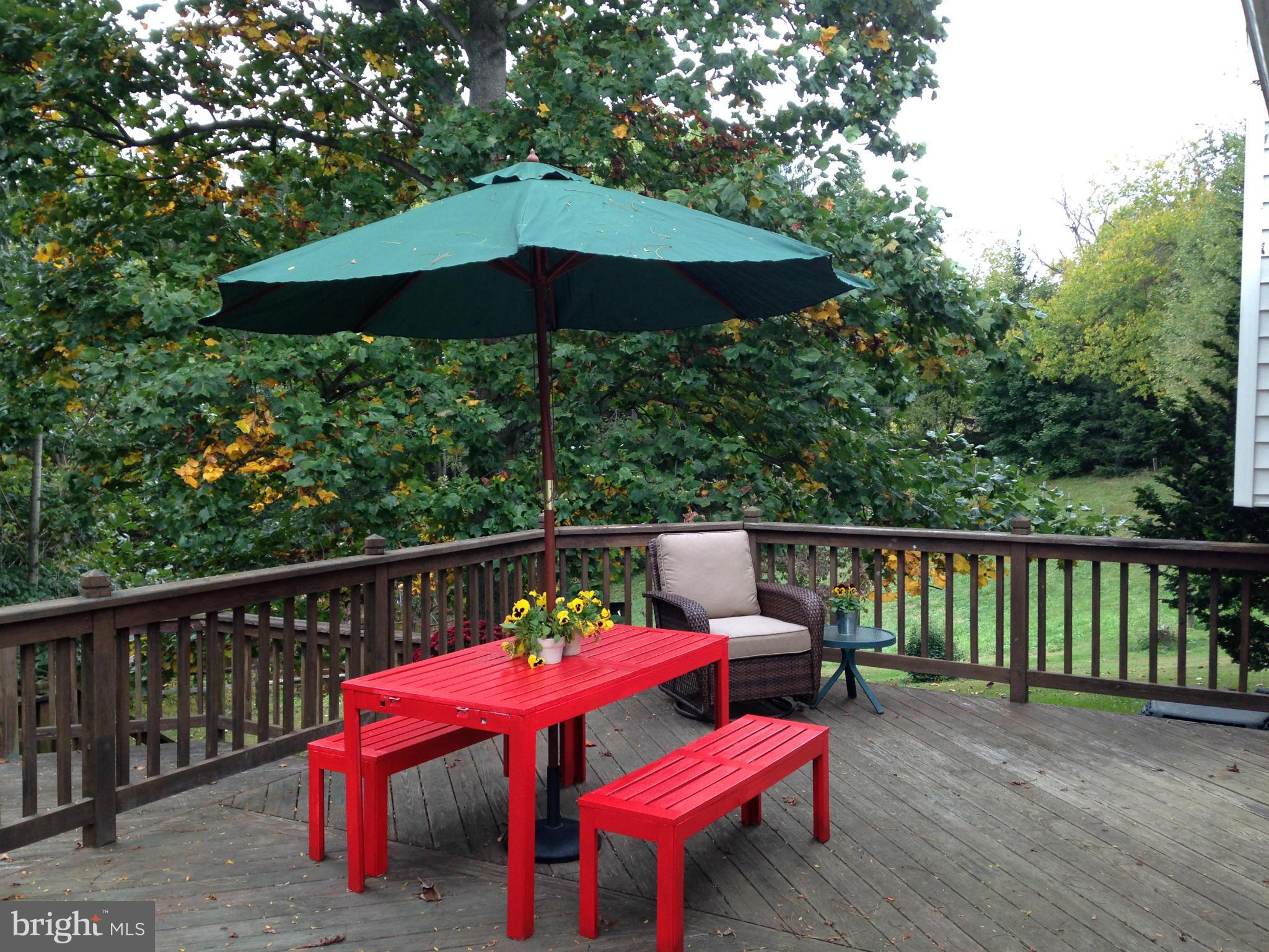 18608 Upper Beckleysville Road Hampstead, MD 21074 - Photo 27 of 29 a view of a deck with furniture and barbeque oven with a small yard