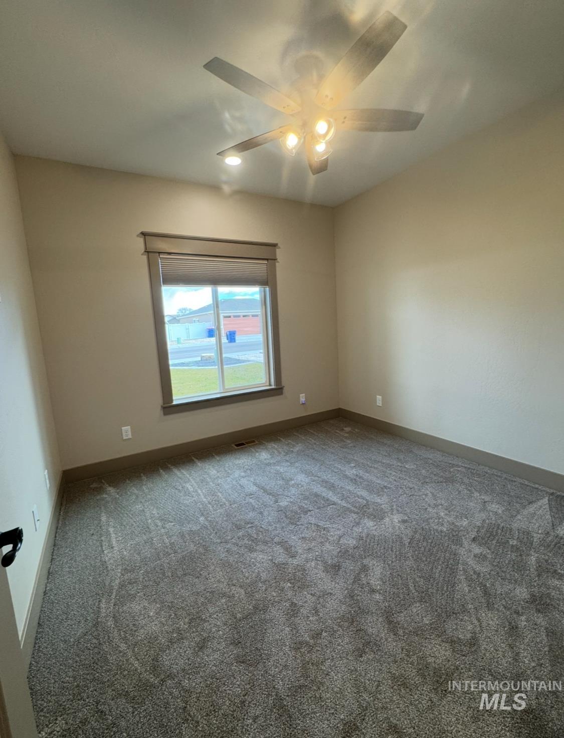 1346 Zephlyn Street Twin Falls, ID 83301 - Photo 24 of 34 Carpeted spare room featuring baseboards and ceiling fan