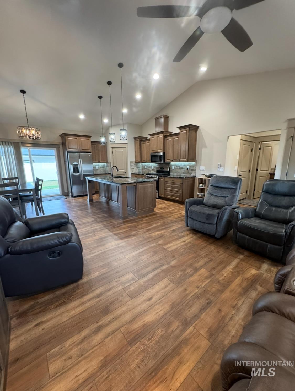 1346 Zephlyn Street Twin Falls, ID 83301 - Photo 10 of 34 Living area with vaulted ceiling, dark wood finished floors, a chandelier, recessed lighting, and ceiling fan