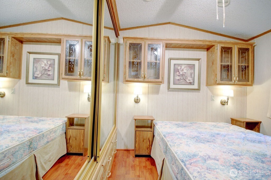 96 Sunset Circle Maple Falls, WA 98266 - Photo 12 of 31 a bedroom with a bed and wooden floor