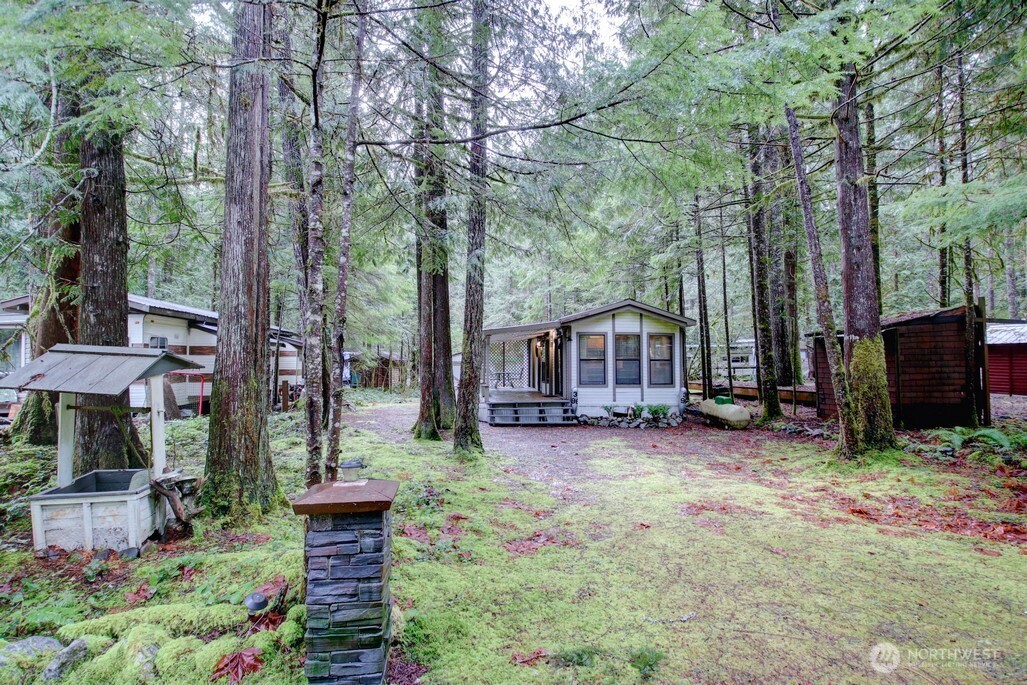 96 Sunset Circle Maple Falls, WA 98266 - Photo 17 of 31 a view of a house with a yard and sitting area