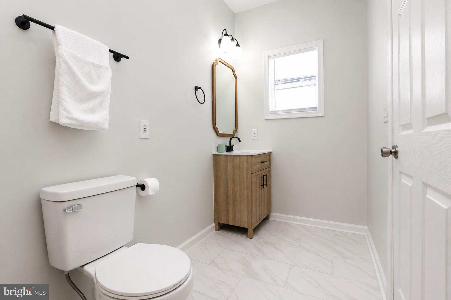 4319 Hadamar Road Spotsylvania, VA 22551 - Photo 18 of 24 a bathroom with a toilet sink and mirror