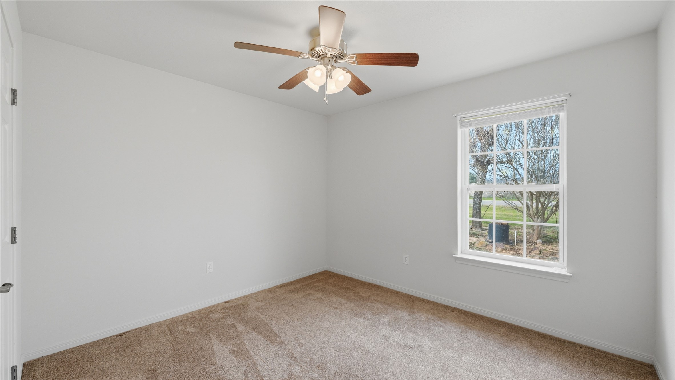 369 Young School House Road Smithville, TX 78957 - Photo 10 of 30 Unfurnished room with light colored carpet and ceiling fan