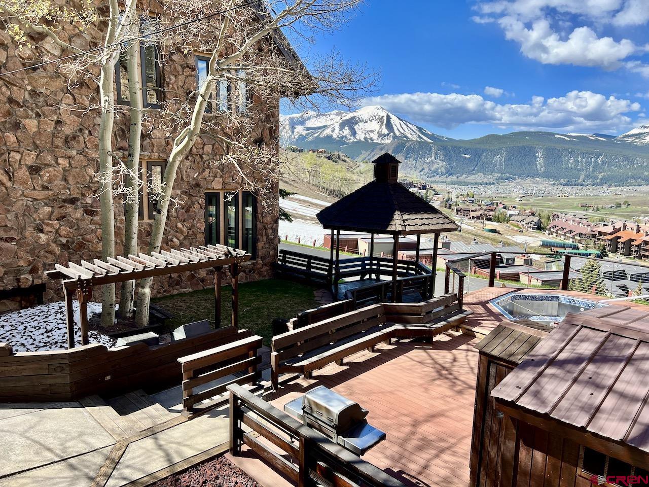 51 Whetstone Road, Unit 2306 Crested Butte, CO 81225 - Photo 36 of 44 a roof deck with table and chairs