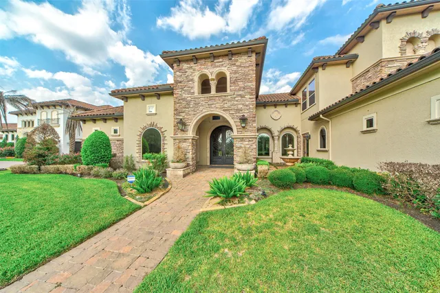 a front view of a house with garden