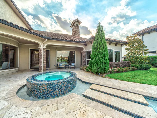 a view of a house with fountain bath and entertaining space