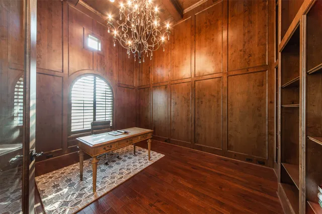 a view of a room with wooden floor and window