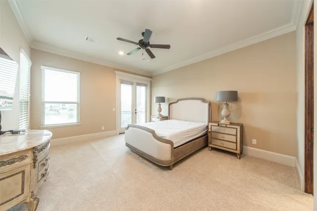 a spacious bedroom with a bed and window