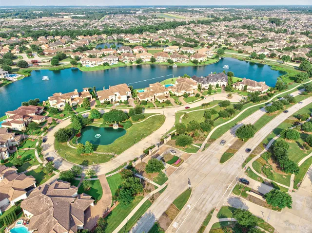 an aerial view of a city with a lake view
