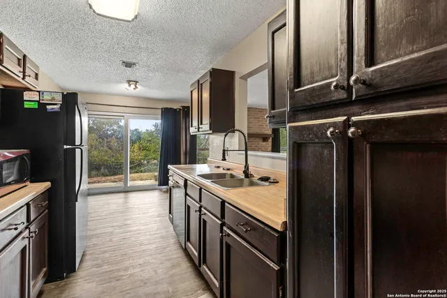 a kitchen with a stove and a refrigerator