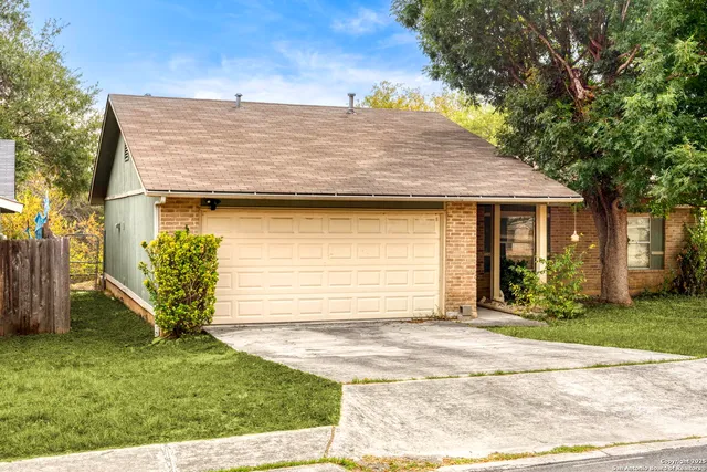 a view of a house with a garden