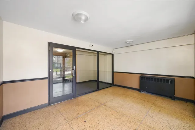 a view of an empty room with a window