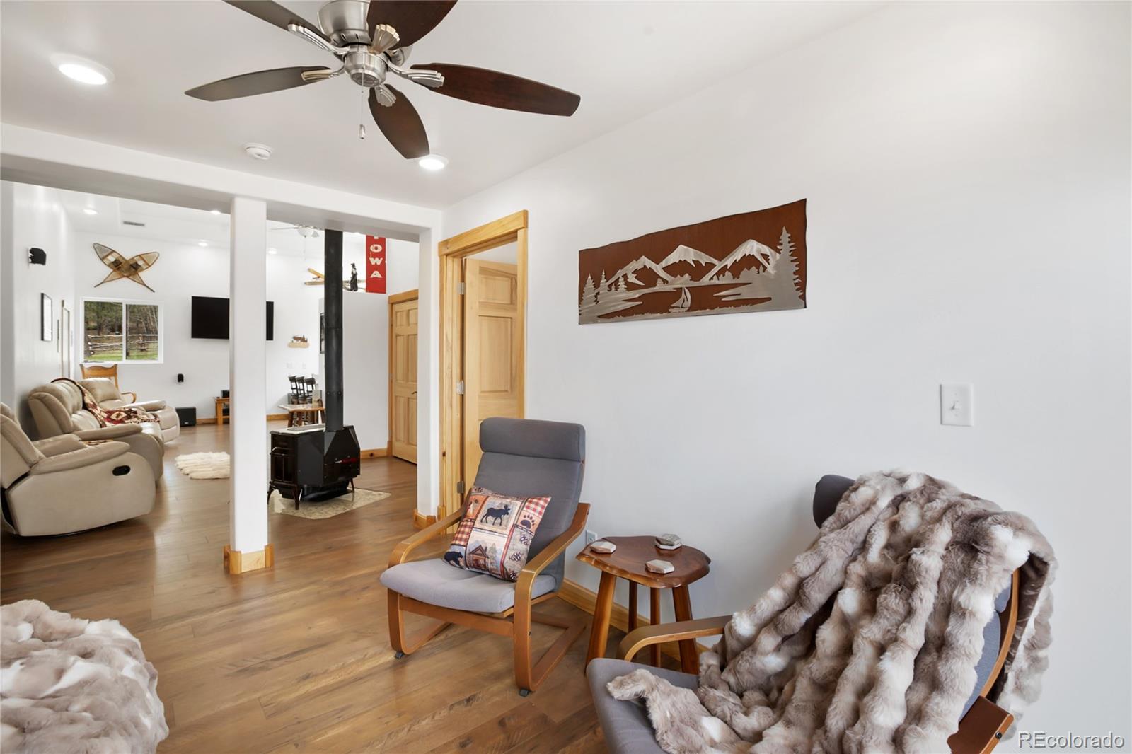437 Langnis Road Guffey, CO 80820 - Photo 13 of 33 a living room with furniture and wooden floor