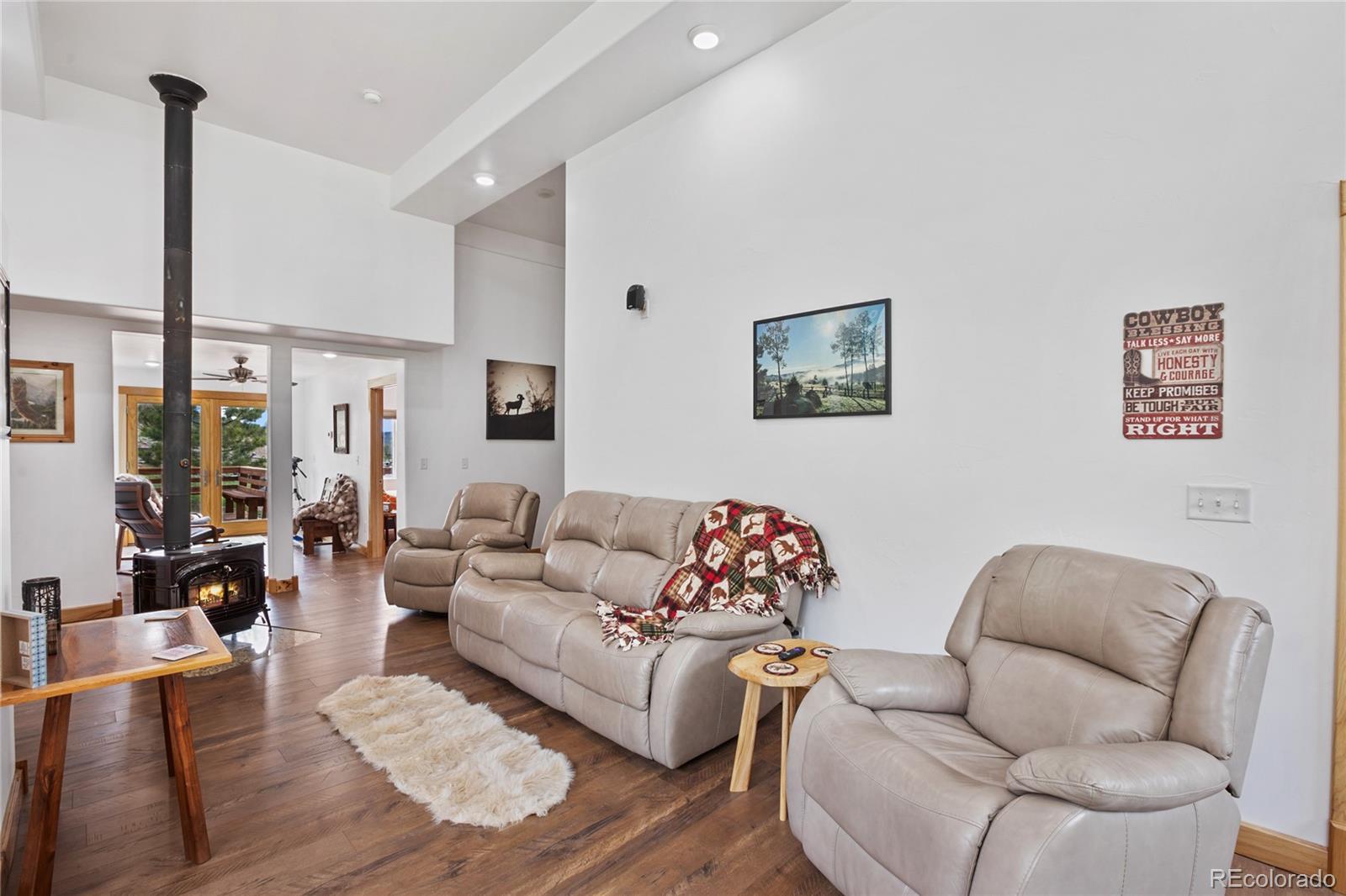 437 Langnis Road Guffey, CO 80820 - Photo 15 of 33 a living room with furniture or couch and a floor to ceiling window