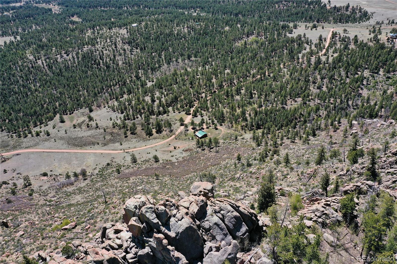 437 Langnis Road Guffey, CO 80820 - Photo 27 of 33 a view of a yard with wooden fence