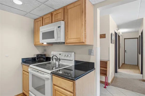 a kitchen with stainless steel appliances granite countertop a sink and a stove