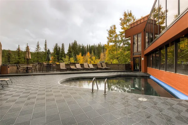 a view of a swimming pool with a patio