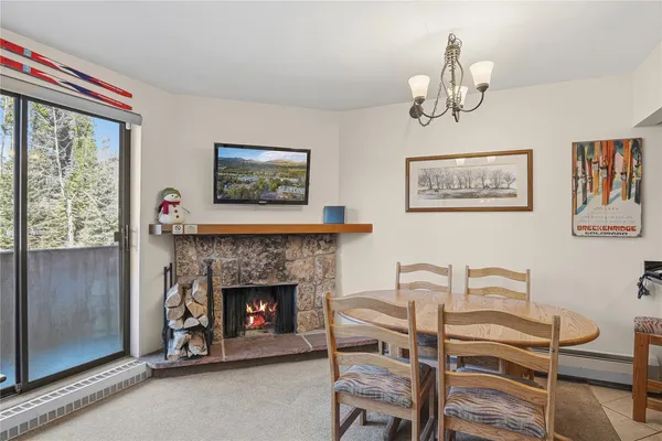 a view of a livingroom with furniture and a fireplace