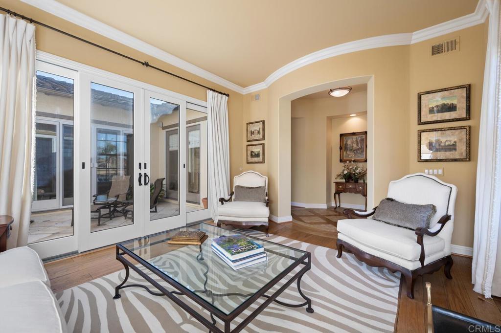 7089 Heron Circle Carlsbad, CA 92011 - Photo 11 of 58 a living room with furniture and wooden floor