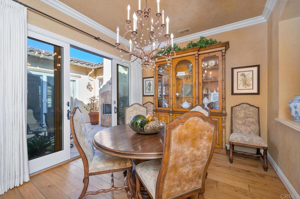 7089 Heron Circle Carlsbad, CA 92011 - Photo 13 of 58 a view of a dining room with furniture and chandelier