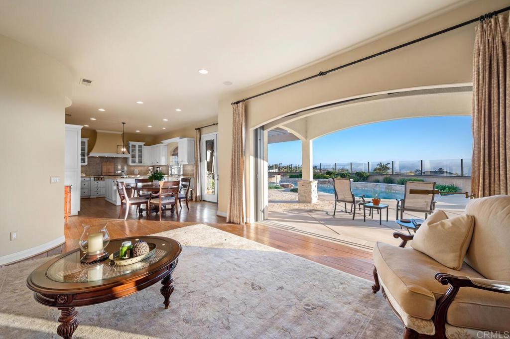 7089 Heron Circle Carlsbad, CA 92011 - Photo 21 of 58 a living room with furniture a rug and a table