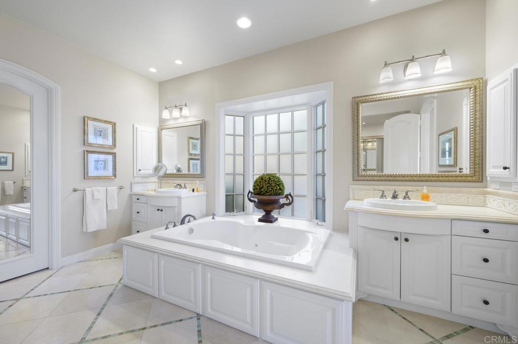 7089 Heron Circle Carlsbad, CA 92011 - Photo 24 of 58 a bathroom with a sink double vanity and a mirror