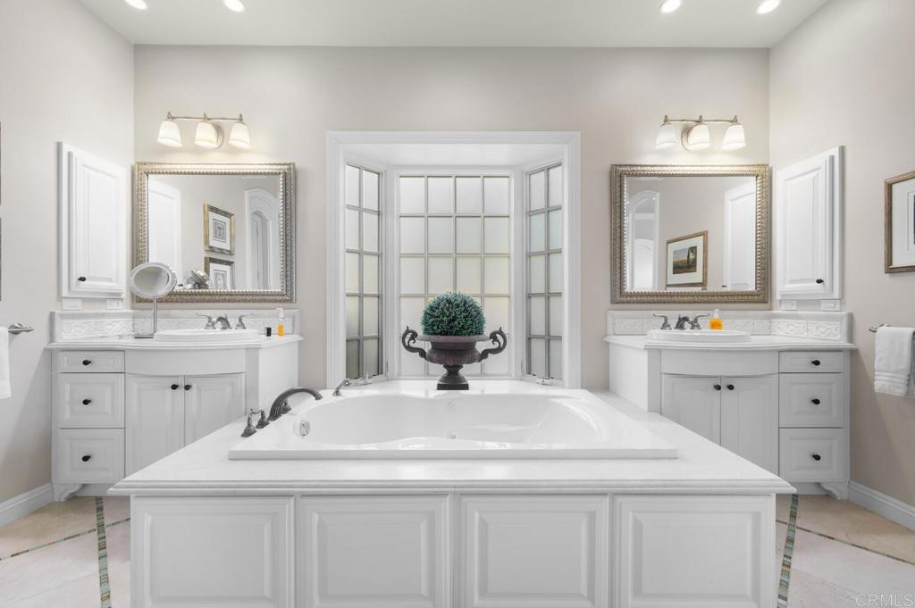 7089 Heron Circle Carlsbad, CA 92011 - Photo 25 of 58 a bathroom with a sink and a mirror