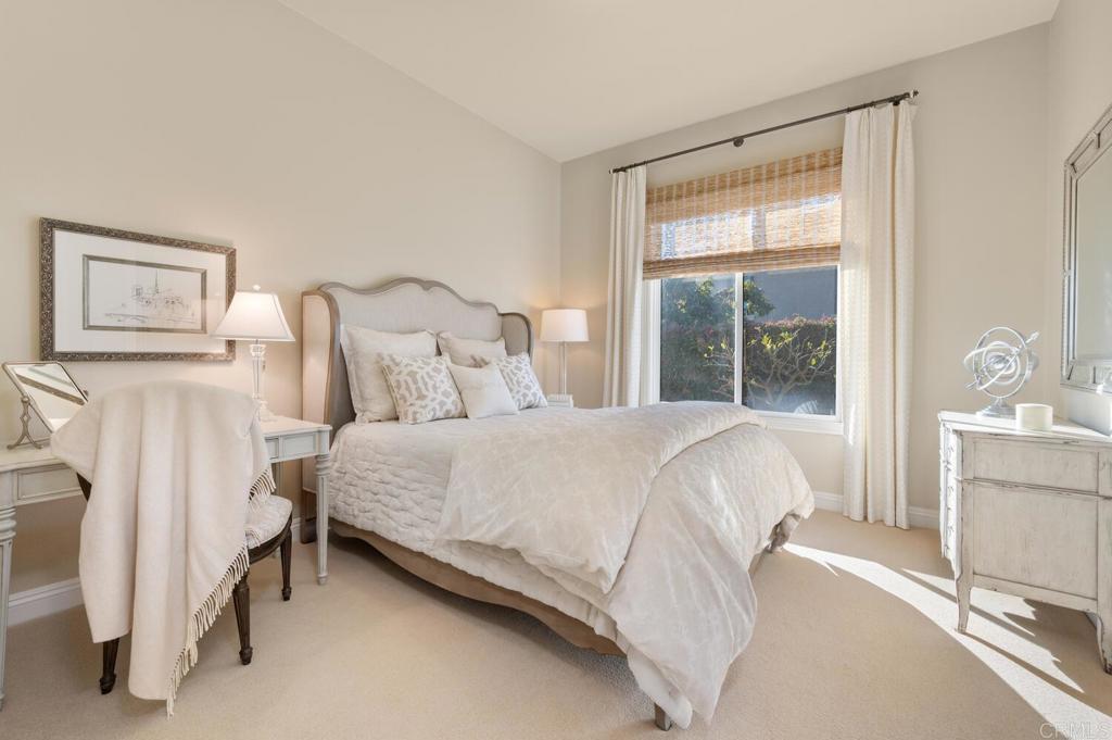 7089 Heron Circle Carlsbad, CA 92011 - Photo 31 of 58 a large bed sitting in a bedroom next to a window