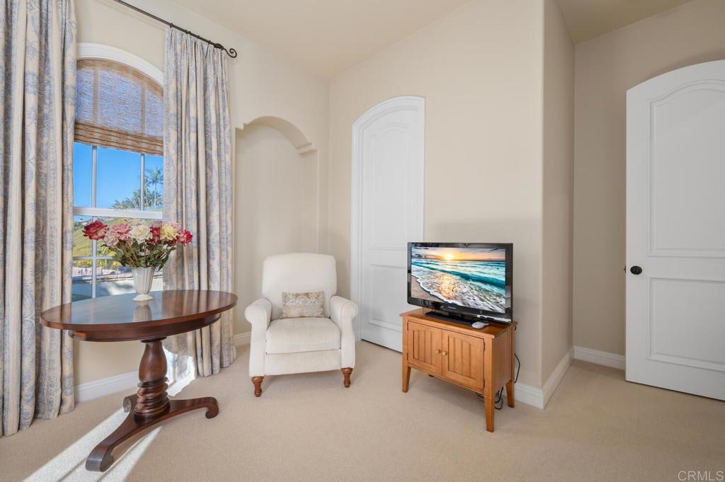 7089 Heron Circle Carlsbad, CA 92011 - Photo 33 of 58 a living room with furniture and a flat screen tv